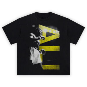 Ali Shadow Legend tee featuring boxing silhouette in grayscale with cracked yellow geometric background and vintage fight energy