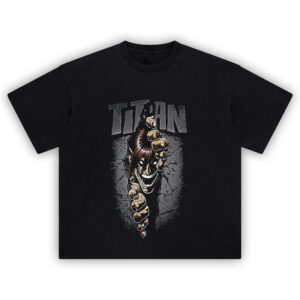 Titan Wallbreaker Tee featuring Eren Yeager’s Attack Titan punching through a stone wall with comic-style intensity