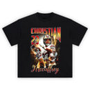Christian McCaffrey CMC 23 Graphic Tee featuring collage of CMC in action with bold fire background and 23 highlights