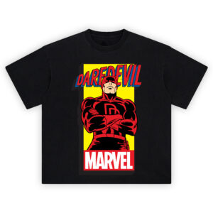 Daredevil Classic Marvel Graphic T-shirt featuring red-suited Daredevil with arms crossed on bold yellow background and retro comic lettering.
