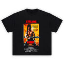Rambo First Blood Part II T-Shirt with Stallone aiming rocket launcher in fiery backdrop