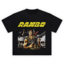 Rambo T-Shirt with Sylvester Stallone holding a machine gun in a battle-ready pose