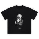 Malcolm X Power Portrait T Shirt with bold black and white halftone design of Malcolm X