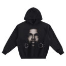 Lauryn Hill Big Face Hoodie graphic showing a centered close-up portrait of Lauryn Hill looking upward with large hoop earrings on a black hoodie.