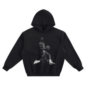 Michael Jordan Hoodie graphic showing a black-and-white action photo of Michael Jordan airborne with a basketball in a Chicago Bulls #23 jersey on a black hoodie.