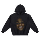 Malcolm-Jamal Warner Big Face Hoodie graphic showing a centered close-up smiling portrait with soft highlights that fade into a black hoodie background.