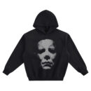 Michael Myers Big Face Hoodie featuring a large black-and-white close-up of Michael Myers’ mask centered on a black hoodie.