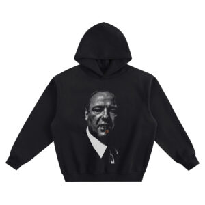 Tony Soprano Big Face Hoodie graphic showing a black-and-white close-up portrait in a suit and tie with a lit cigar featuring a glowing orange ember on a black hoodie.