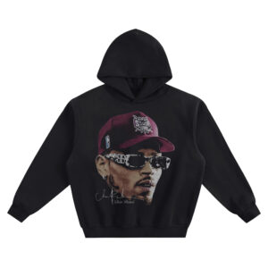 Chris Brown Big Face Hoodie graphic showing an angled close-up portrait of Chris Brown in a red cap with patterned wrap sunglasses and a signature-style “Chris Brown” detail on a black hoodie.