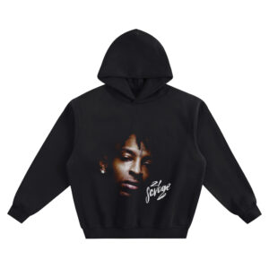 21 Savage Big Face Hoodie graphic showing a close-up shadow portrait of 21 Savage with a forehead tattoo, diamond stud earring, and white “21 Savage” script on a black hoodie.