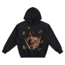 Mariah the Scientist Big Face Hoodie graphic showing a close-up portrait with hands framing the face, red nails, yellow butterflies, and signature detail on a black hoodie.