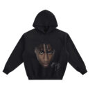NBA YoungBoy Big Face Hoodie graphic showing a close-up portrait with forward twists, heart mark under the eye, and “#4B” handwritten tag on a black hoodie.