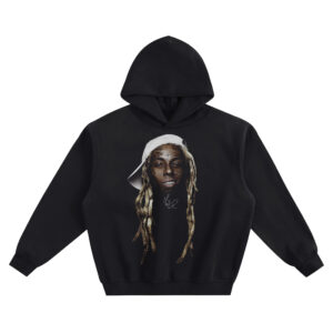 Lil Wayne Big Face Hoodie graphic showing a close-up portrait with a tilted white cap, long blond dreadlocks, visible facial tattoo details, and a small signature mark on a black hoodie.