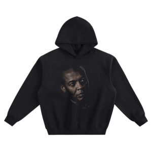Dr. Dre Big Face Hoodie graphic showing a close-up portrait with a side gaze, bald head, stud earring detail, and shadowed lighting on a black hoodie.