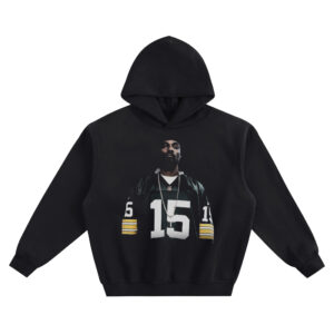 Snoop Dogg Big Face Hoodie graphic showing a centered portrait wearing a dark football jersey with a large white 15, yellow sleeve stripes, and a long chain necklace on a black hoodie.