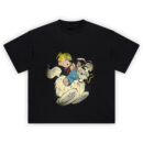 Dennis the Menace Graphic Tee graphic showing a blond kid in blue overalls and a red-and-black striped shirt riding a fluffy white dog in a cartoon tugging scene on a black tee.