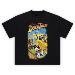 DuckTales Graphic Tee graphic showing “Disney’s DuckTales” title above Scrooge McDuck swinging on a rope with a yellow plane and character crew leaning from the windows.