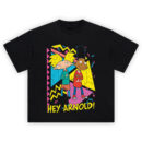 Hey Arnold Tee graphic showing Arnold and Gerald with arms crossed over a colorful 90s geometric background with yellow “HEY ARNOLD!” text on a black tee.
