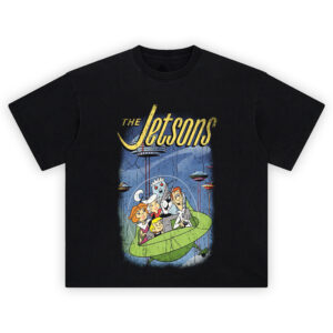 The Jetsons Graphic Tee graphic showing large yellow “THE Jetsons” script above a blue futuristic city scene with the family riding in a green flying car under a clear dome on a black tee.