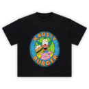 Krusty Burger Graphic Tee graphic showing a blue circle logo with orange “KRUSTY BURGER” text around Krusty smiling in a pink shirt and blue bow tie while holding a dripping cheeseburger on a black tee.