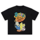 Rocko's Modern Life Graphic Tee graphic showing a yellow-orange splat “ROCKO’S MODERN LIFE” logo above Rocko in a blue patterned shirt and Spunky with yellow eyes and tongue out on a black tee.