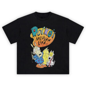 Rocko's Modern Life Graphic Tee graphic showing a yellow-orange splat “ROCKO’S MODERN LIFE” logo above Rocko in a blue patterned shirt and Spunky with yellow eyes and tongue out on a black tee.