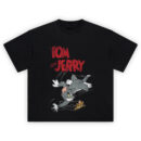 Tom and Jerry Graphic Tee featuring distressed red “TOM and JERRY” text above Tom chasing Jerry in a classic cartoon action scene.